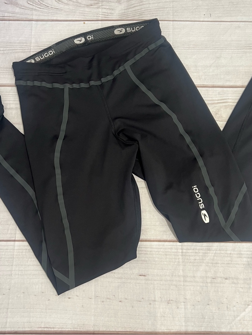 SUGOI Black women's Performance Leggings with Reflective Trim large